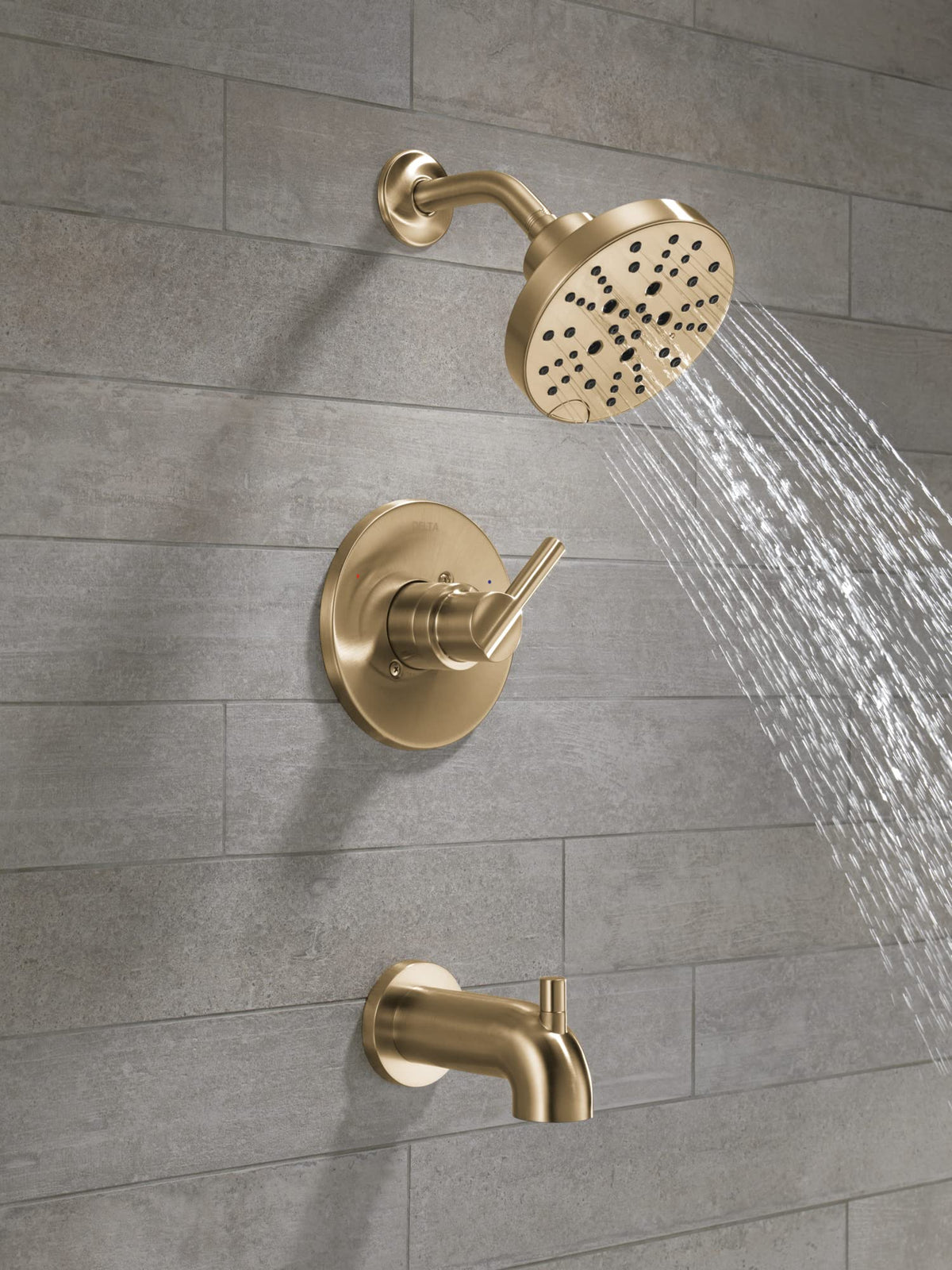 Delta Nicoli brushed-gold handle highlights elegant design with durable finish.