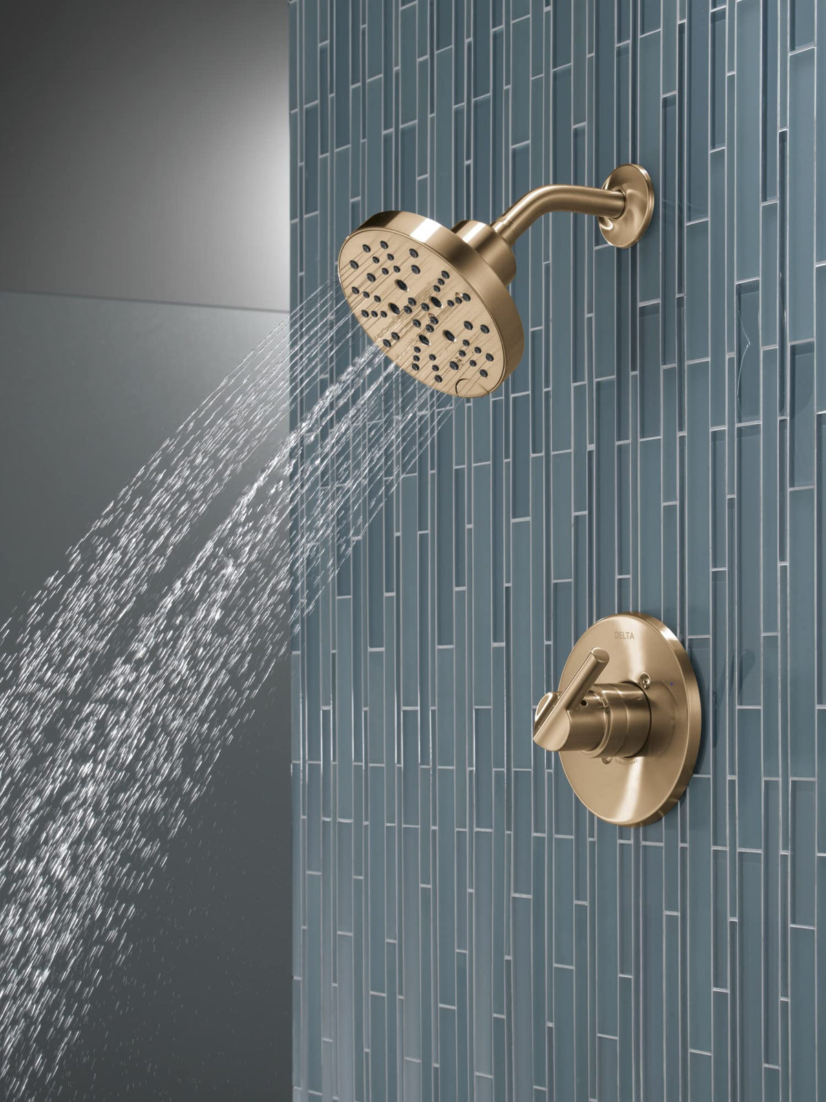 Delta Nicoli 14 Series shower handle in Brushed Gold offers precise control.