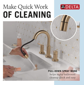 Delta Nicoli brushed gold faucet spout close-up highlights clean lines.