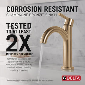 Delta Nicoli brushed gold faucet handle closeup highlights smooth operation.