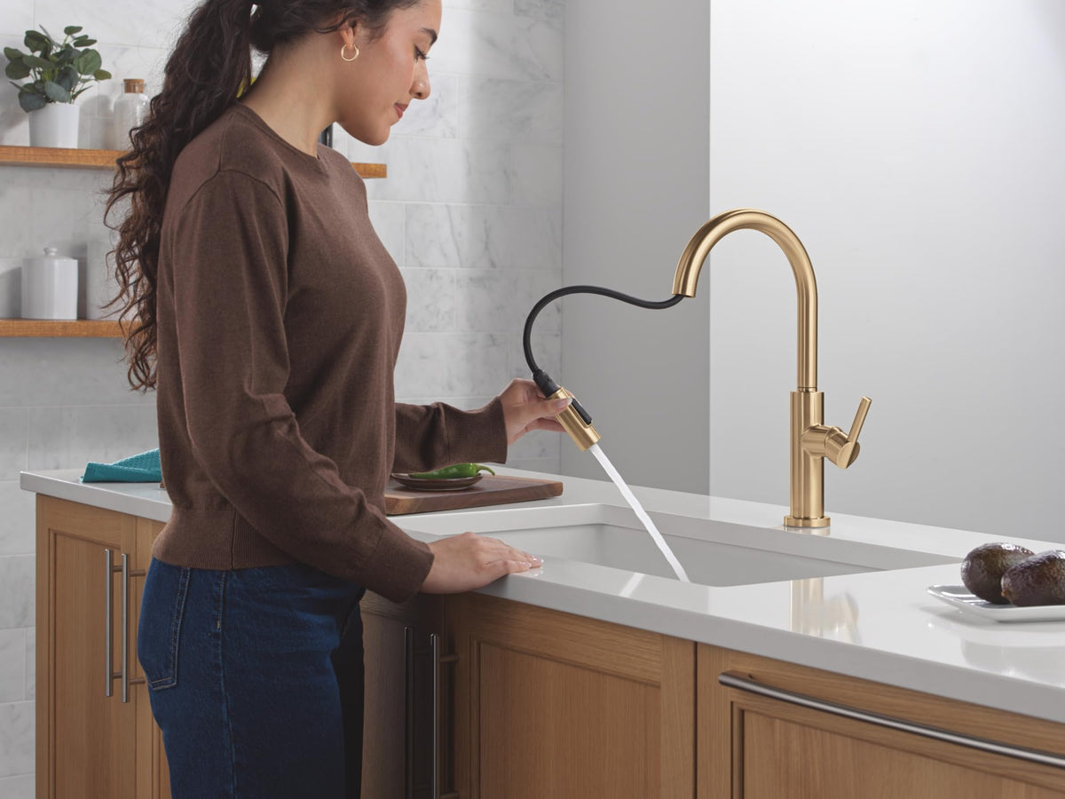 Delta Nicoli deck plate shown with brushed gold faucet installation options.