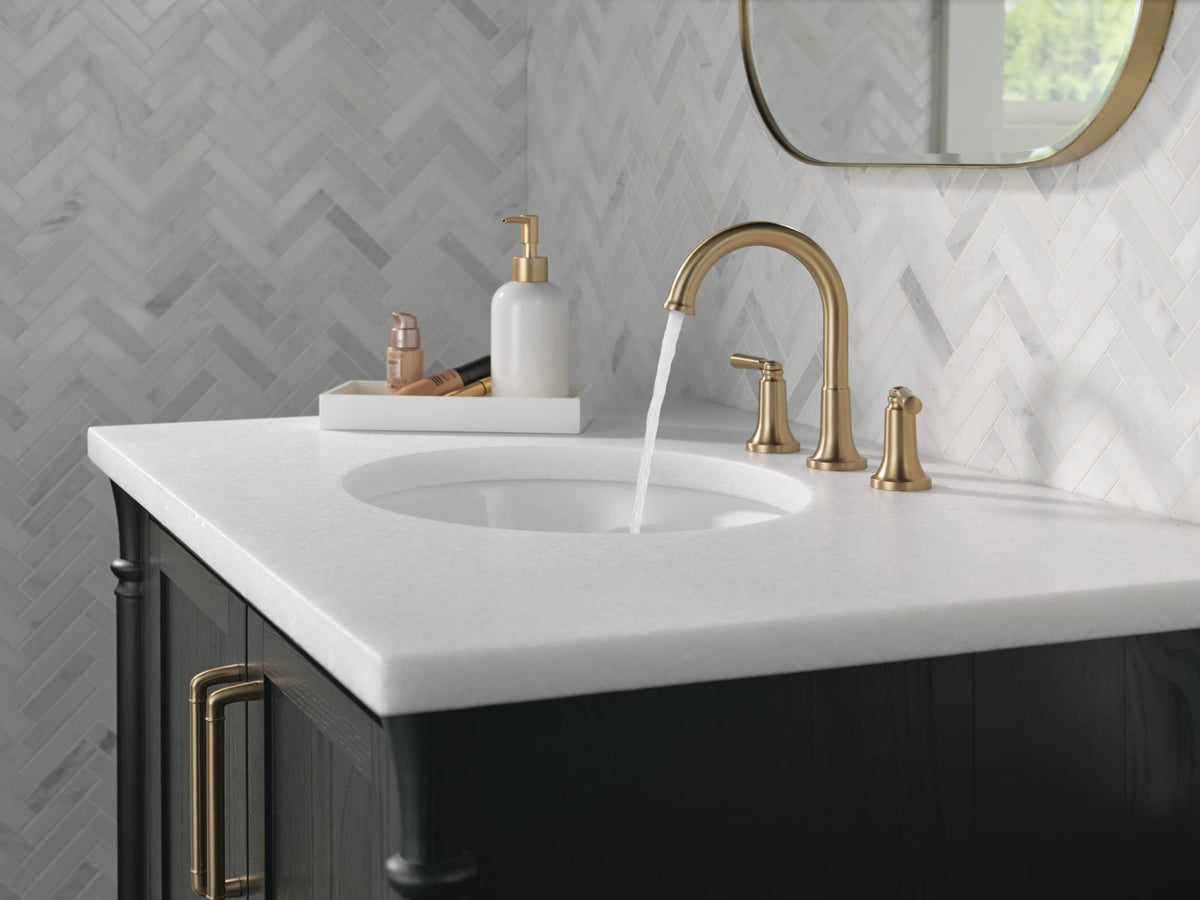 Delta Saylor brushed gold faucet handle closeup demonstrates ergonomic control