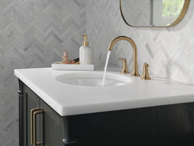 Delta Saylor brushed gold faucet handle closeup demonstrates ergonomic control