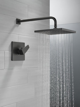 Delta matte black shower trim kit enhances contemporary style with durable finish.