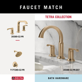 Delta Tetra double towel hook holding robes and towels in a compact setup.