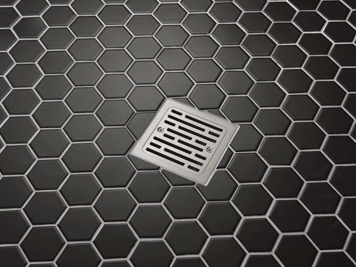 Delta tile-in square drain chrome finish complements contemporary showers.
