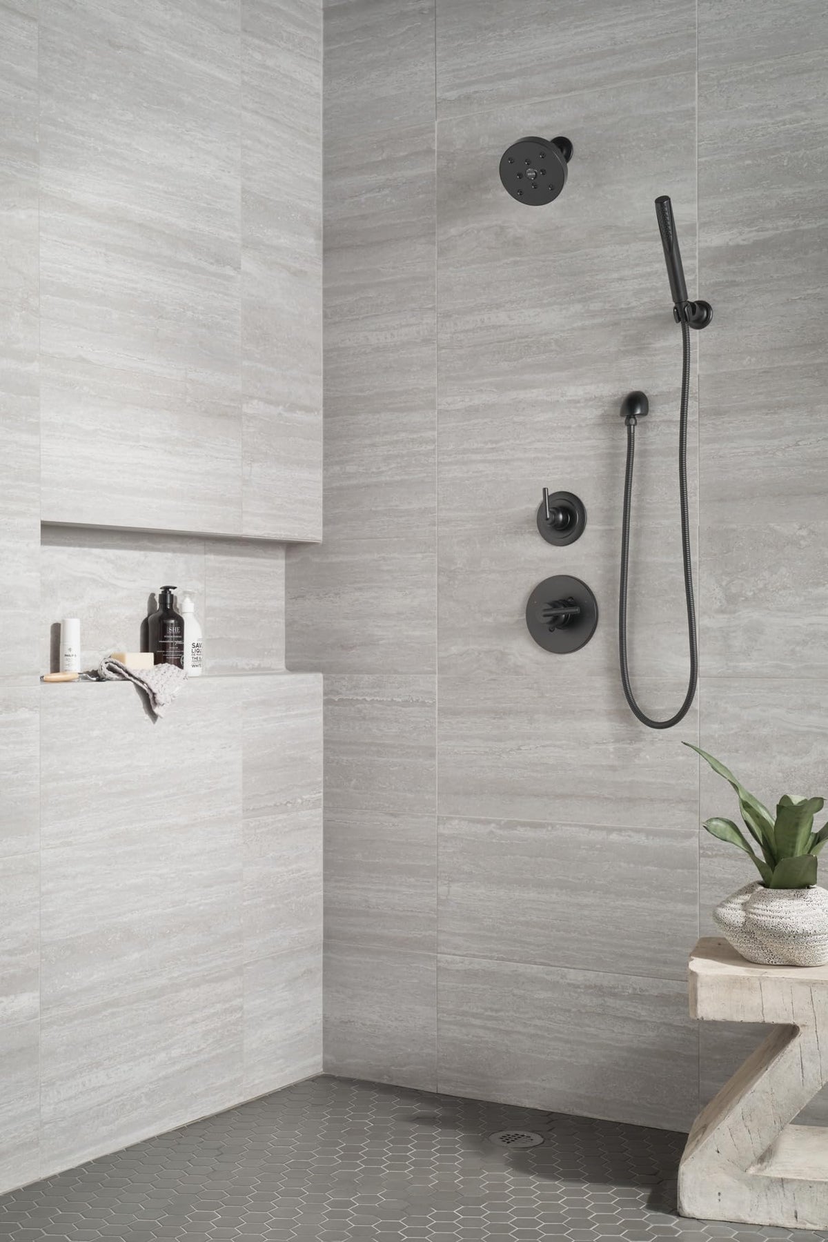 Delta Trinsic matte black wall elbow option enhances custom shower layouts.