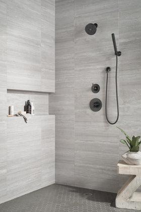 Delta Trinsic matte black wall elbow option enhances custom shower layouts.