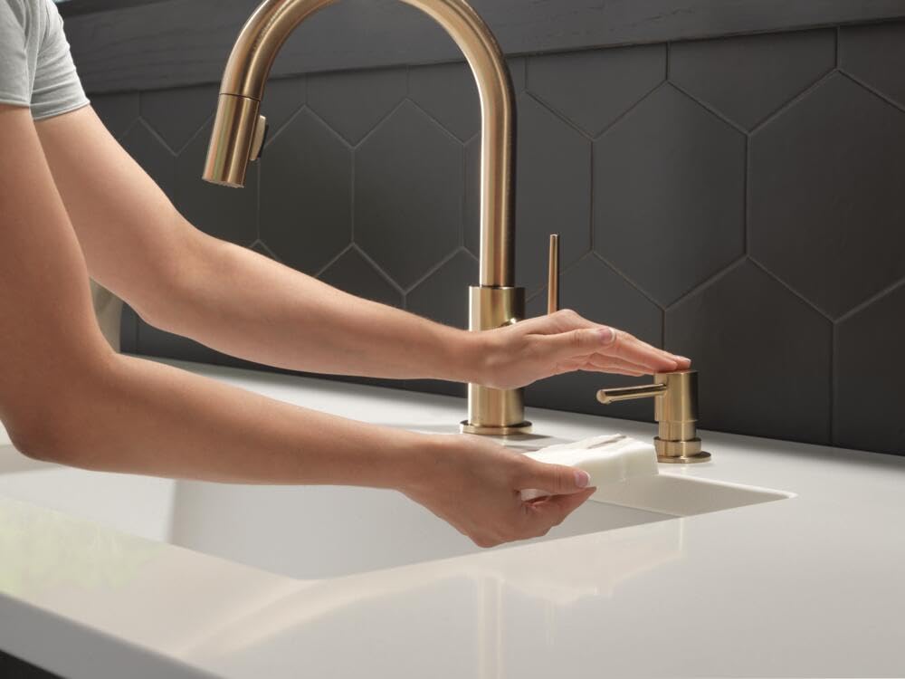 Delta Trinsic deck-mount soap dispenser shown beside kitchen sink for easy access