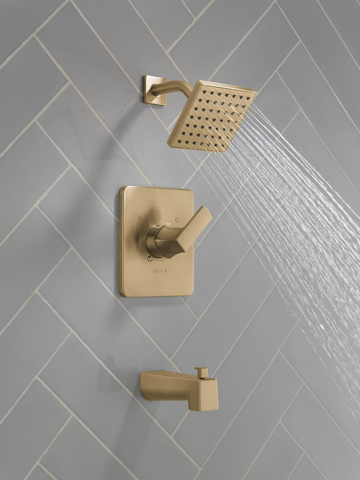 Delta Velum 14 brushed gold shower head showcases bold style and water-saving performance.