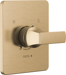 Delta Velum 14 Series brushed gold handle closeup showing contemporary hardware.