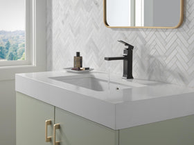 Delta Velum matte black faucet side view shows a durable finish for lasting style.