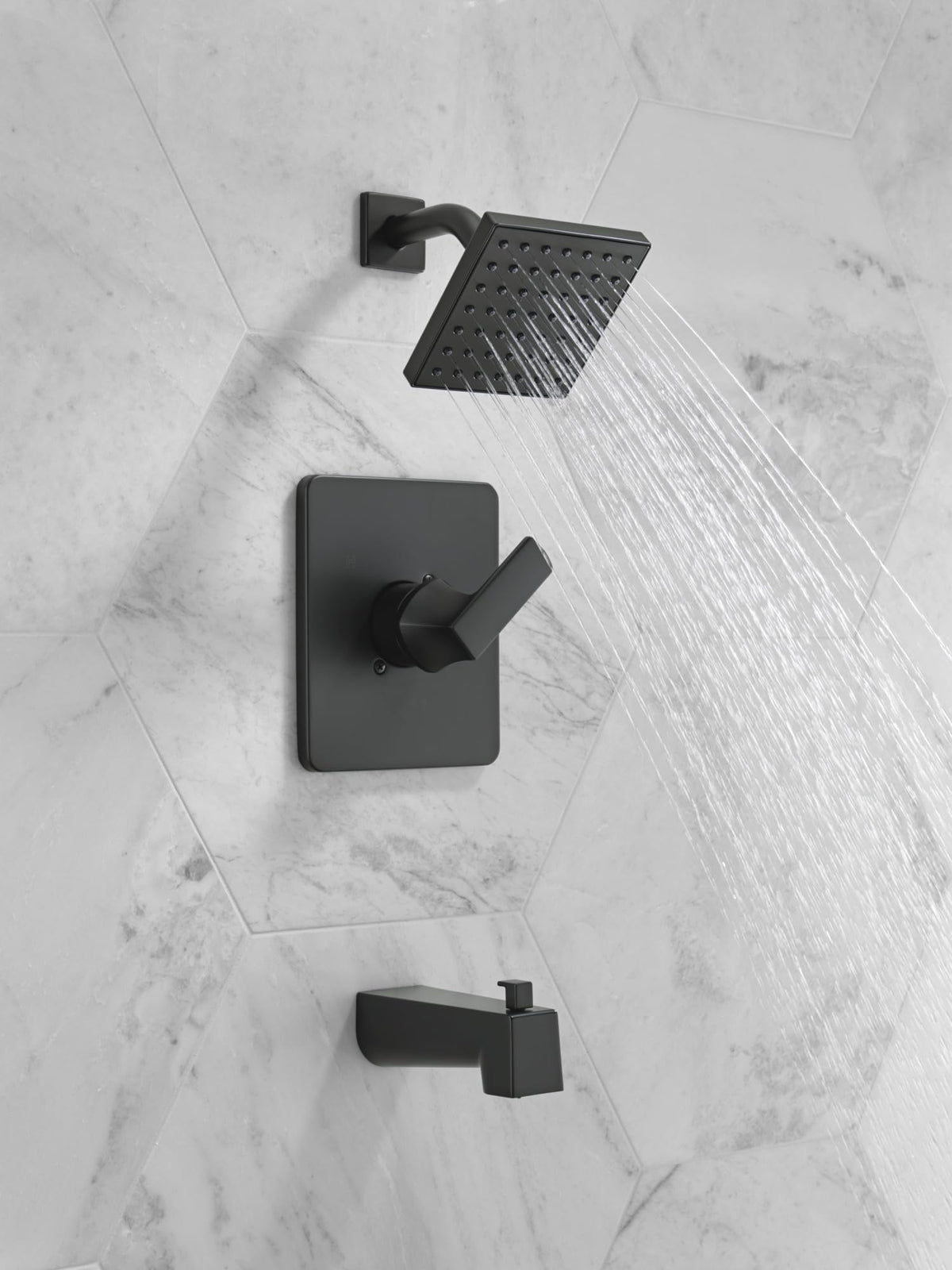 Delta Velum matte black shower head close-up showing a durable finish.