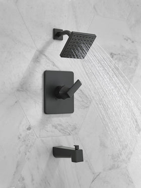 Delta Velum matte black shower head close-up showing a durable finish.