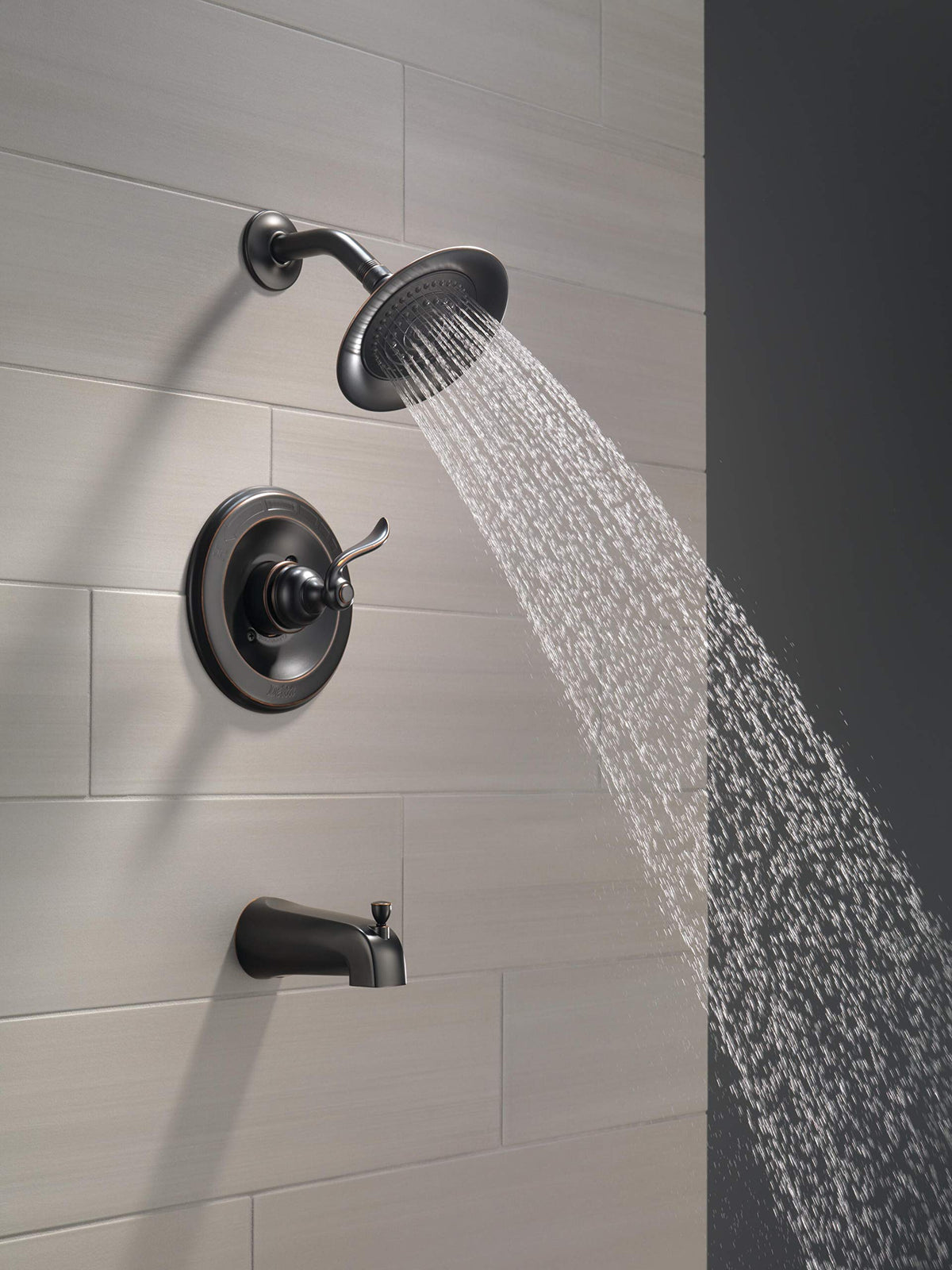 Delta Windemere OB shower head close-up: durable finish resists wear for lasting shine.