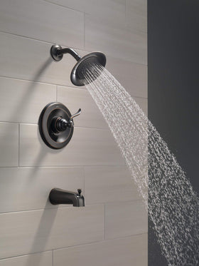 Delta Windemere OB shower head close-up: durable finish resists wear for lasting shine.