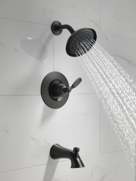 Delta Woodhurst 14 Series matte black single-spray shower head for focused water flow.