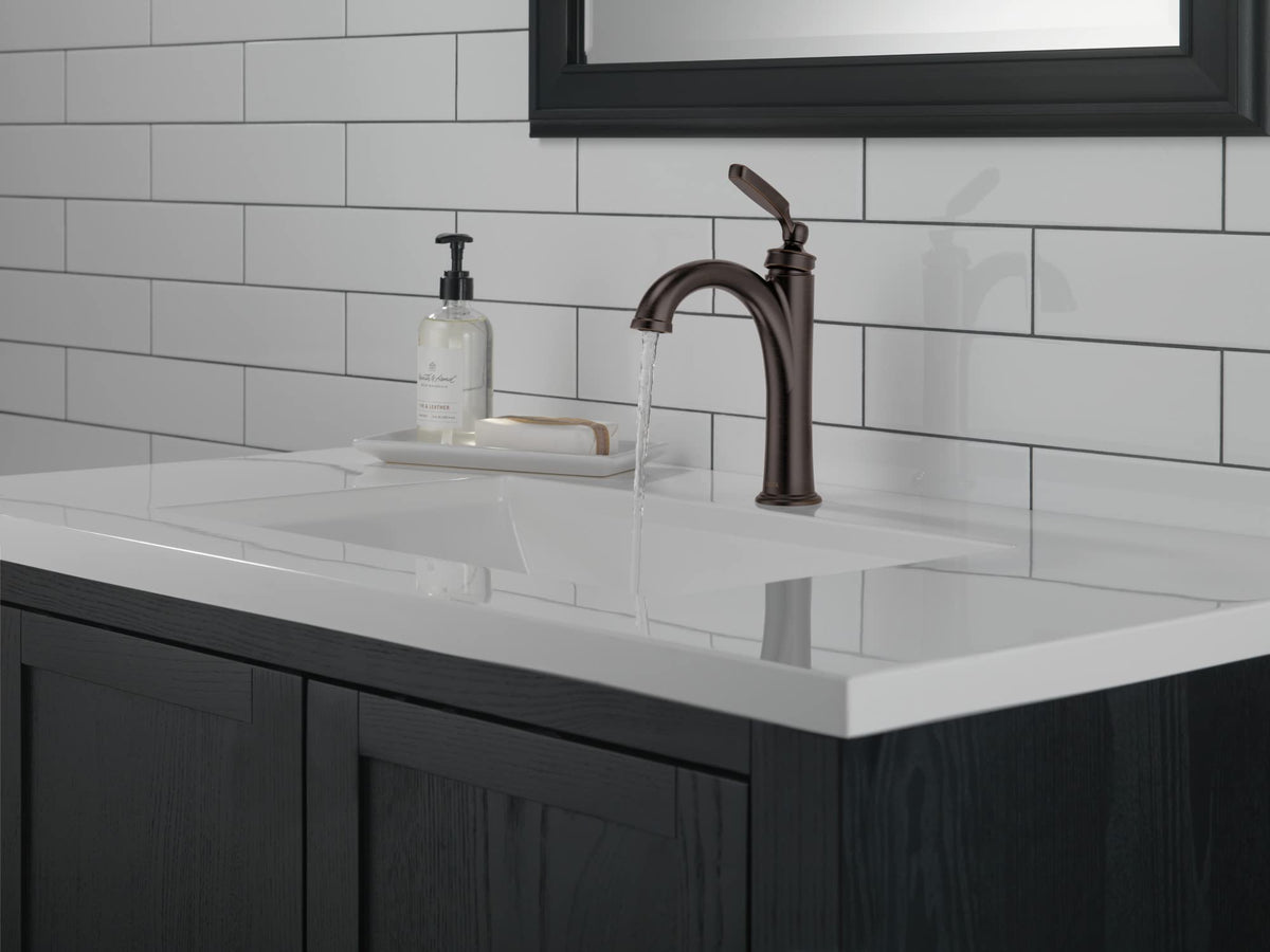 Delta Woodhurst side view shows single-hole compatibility for vanities
