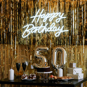 Dengduoduo neon sign illuminating a themed party backdrop.