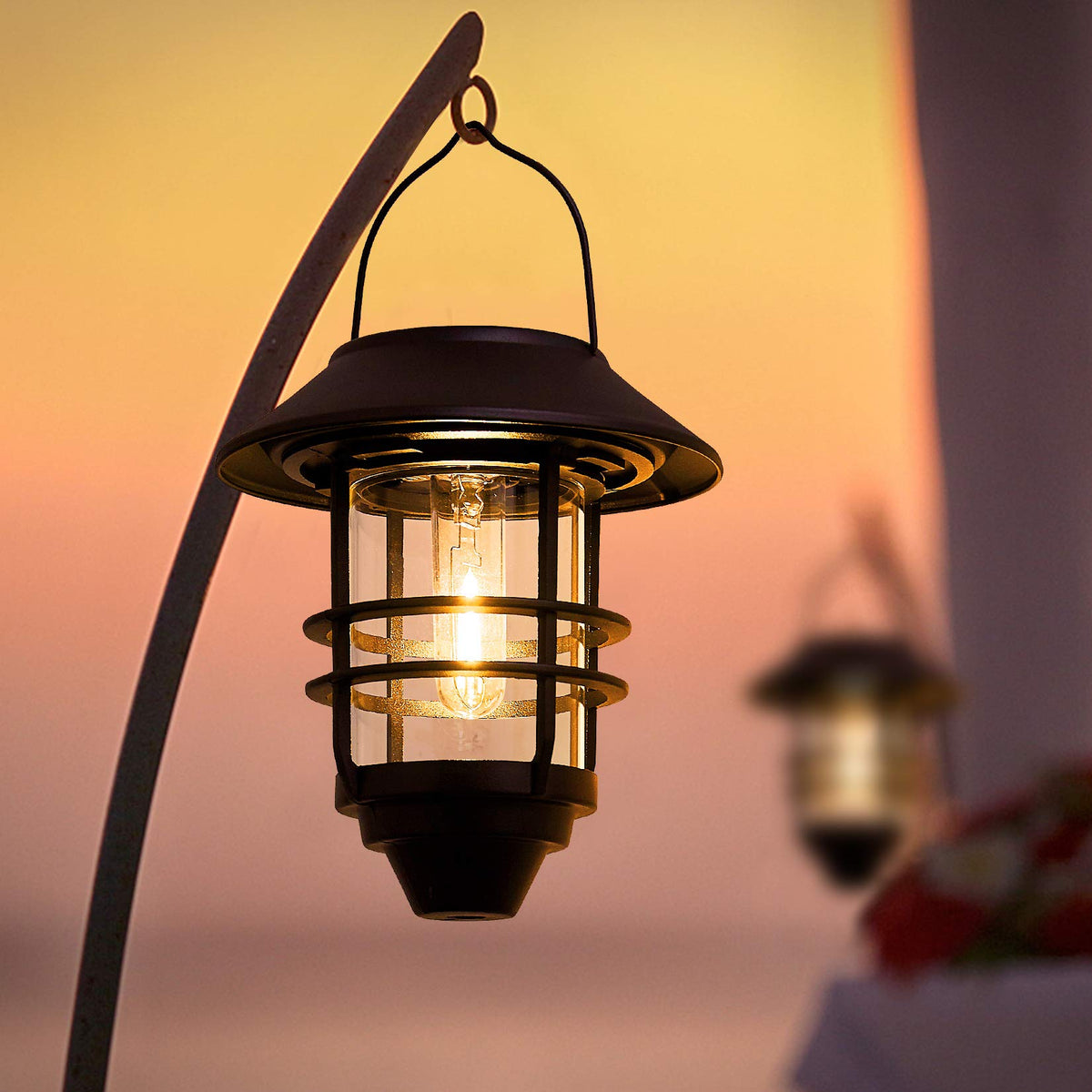 Derynome solar lantern hanging on hook for easy exterior lighting.