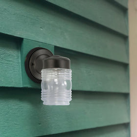 Design House Jelly Jar Wall Light uses standard E26 bulbs for easy replacement.