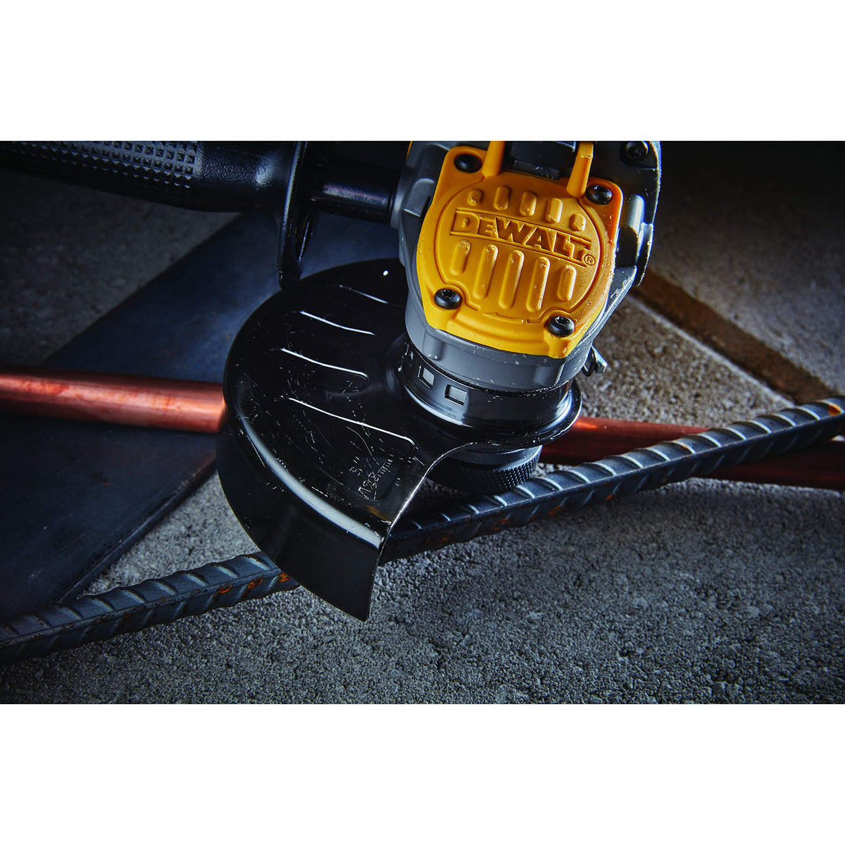 DEWALT angle grinder with paddle switch for secure handling during cuts