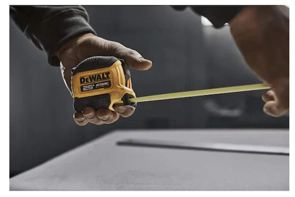 DEWALT Atomic 25 ft tape measure compact grip enhances ergonomics.
