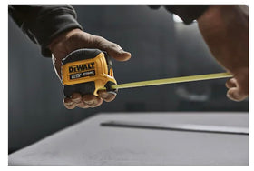DEWALT Atomic 25 ft tape measure compact grip enhances ergonomics.
