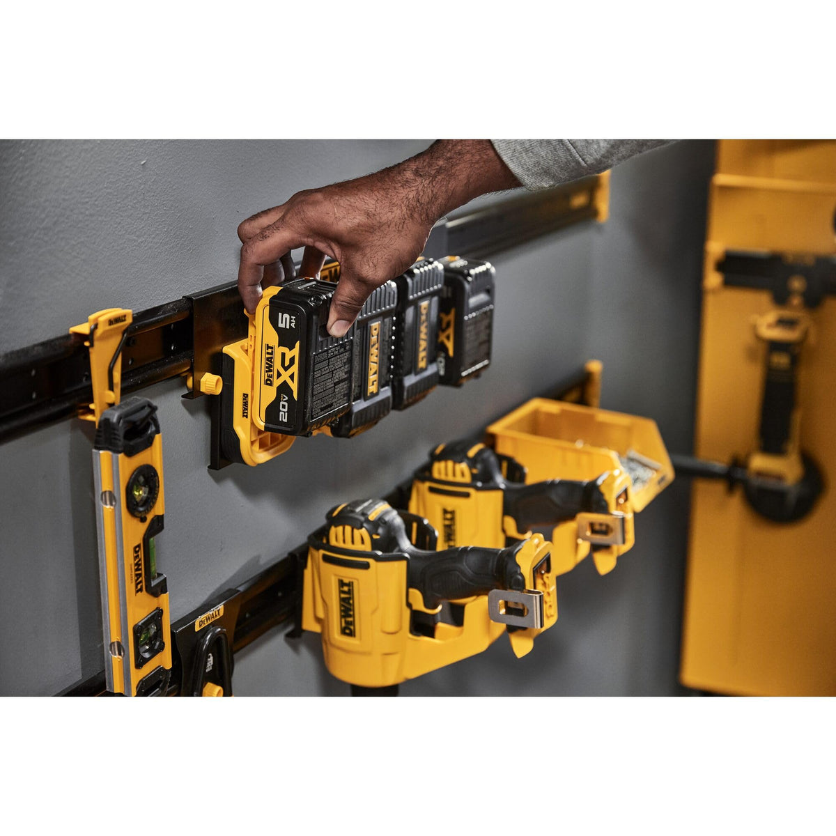 DEWALT battery organizer in a hectic workshop keeps batteries organized