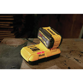 Wall-mount compatible design keeps the charger accessible on site.