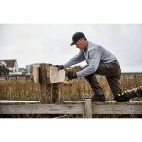 DEWALT DCF860B in-use scene driving a screw with power and speed.