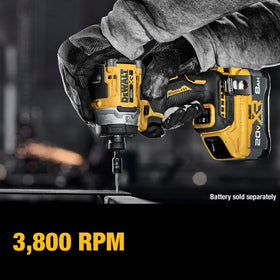 DEWALT DCF860B driver at a metal piece demonstrates efficient torque and control.