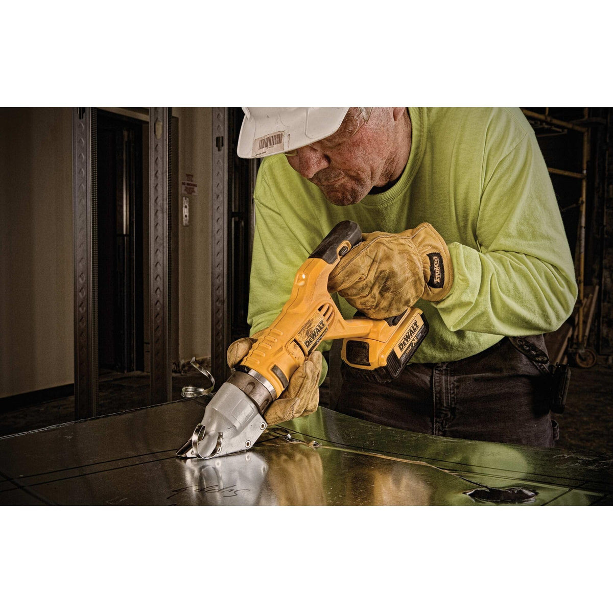 DEWALT DCS494B cutting action demonstrates clean 14ga steel cuts.