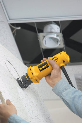 Adjustable guide on the DEWALT DW660 for accurate cutouts