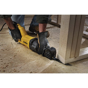 DEWALT DWE305 in action demonstrating cutting performance on varied material.