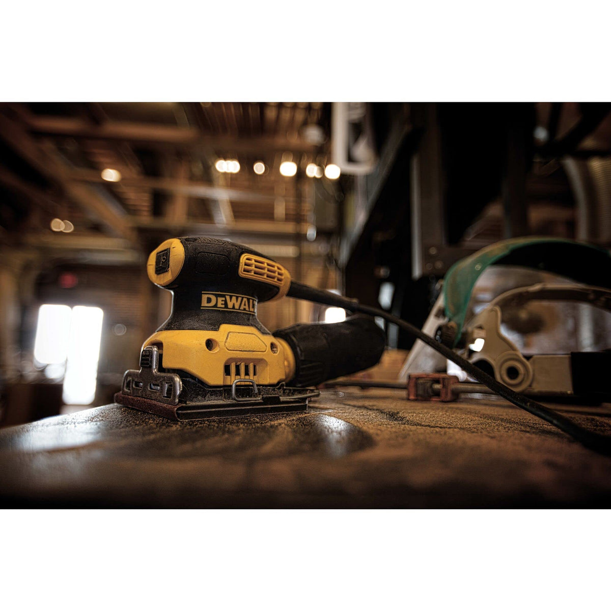 DEWALT palm sander DWE6411K side view highlights reduced height for close work.