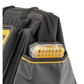 DEWALT professional tool bag on jobsite demonstrates organized storage while multitasking.