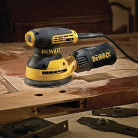 DEWALT DWE6423 hook-and-loop pad allows fast grit changes.