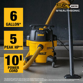 DEWALT StealthSonic vacuum with extended hose demonstrates reach for hard-to-access areas.