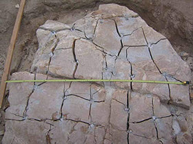 Dexpan drill-hole pattern guiding controlled cracks.