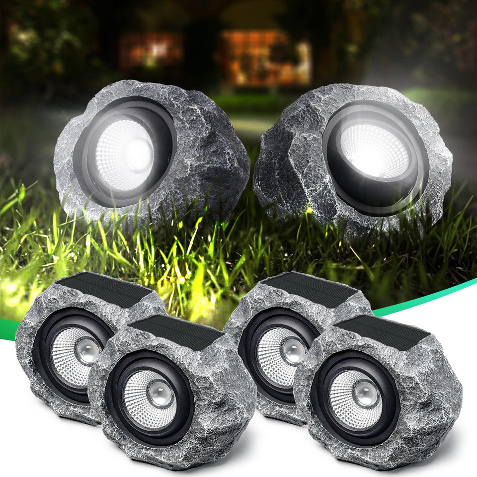 DGSCAK solar rock light four-pack for outdoor paths with soft white glow.