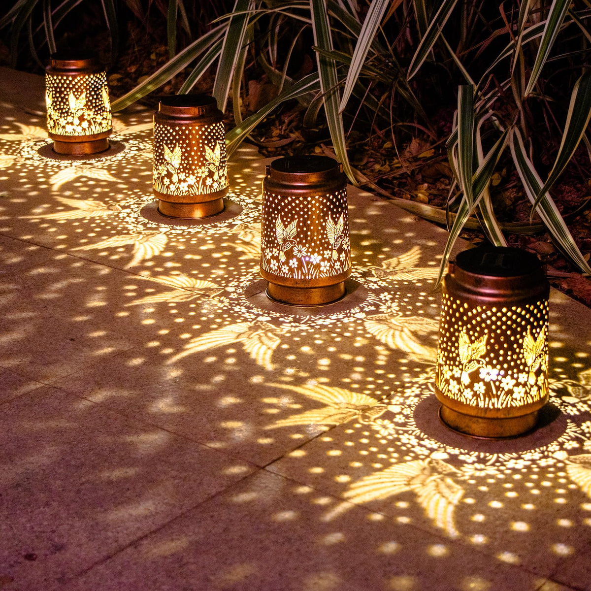 DIBIEECN hummingbird solar lantern ground placement brightens the porch with warm light.