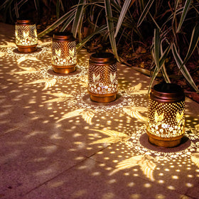 DIBIEECN hummingbird solar lantern ground placement brightens the porch with warm light.