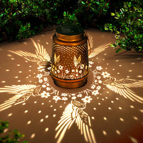 DIBIEECN solar hummingbird lantern front view glowing for outdoor spaces