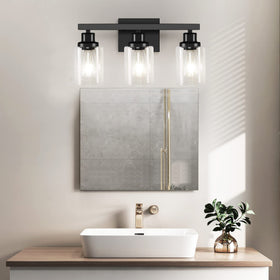 DIKAIDA black wall light over mirror provides focused illumination for grooming.
