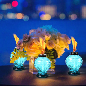 DIKAIDA 4-pack glass table torch showing wick and snuffer for easy lighting