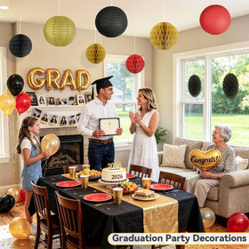 Dimhut 12-inch paper fan in black with gold polka dots for luxe ceiling accents