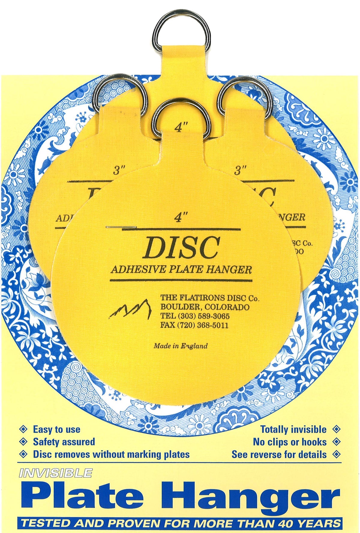 Disc Flatirons 3-inch adhesive hanger securing a small plate to the wall.