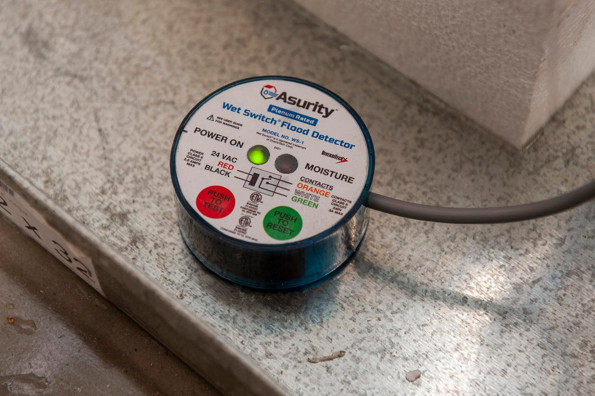 Diversitech Wet Switch Flood Detector hydrophilic pad close-up demonstrates rapid water draw