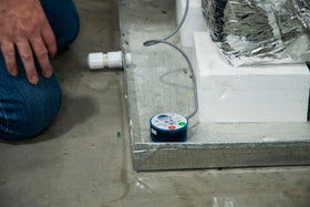 Diversitech Wet Switch Flood Detector top view demonstrates easy access test button